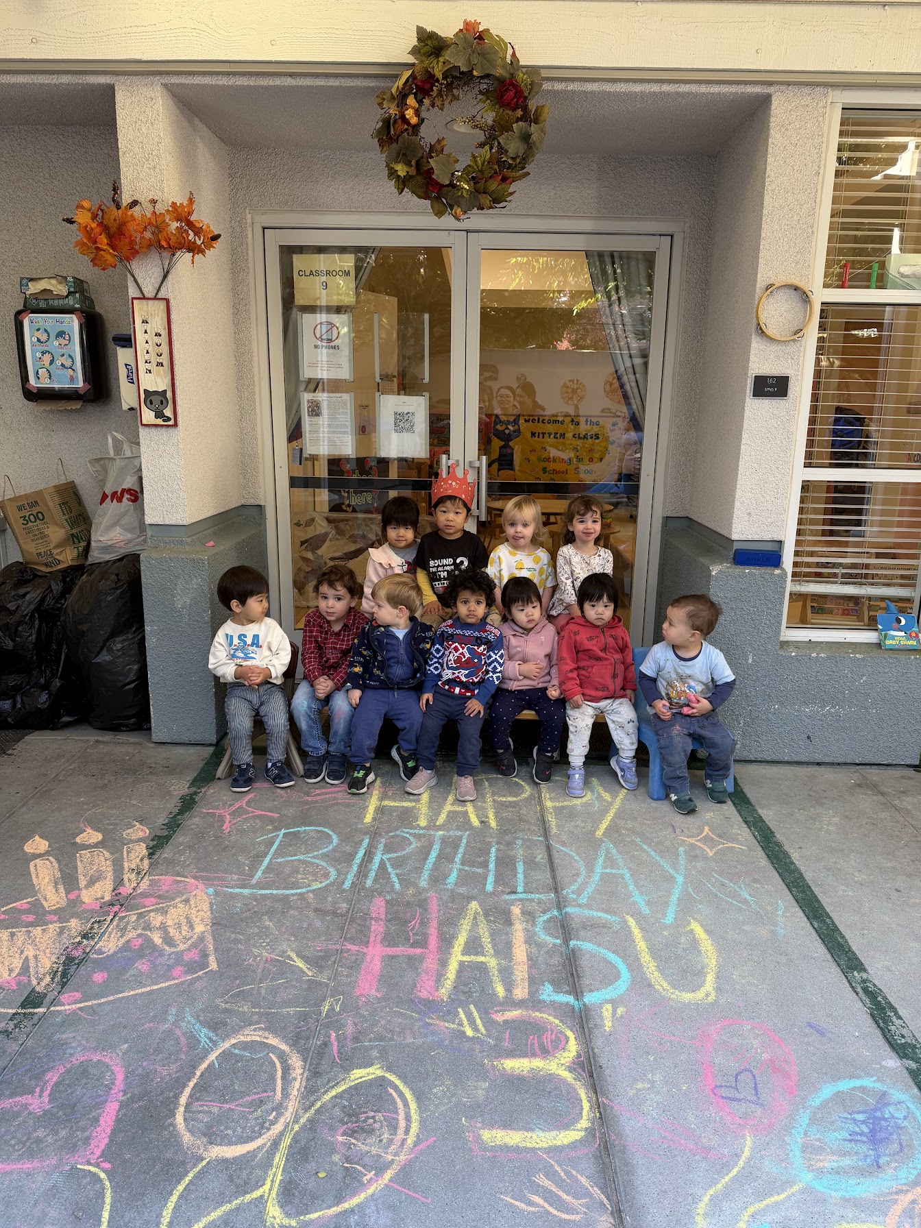 Classroom celebration with teachers and classmates